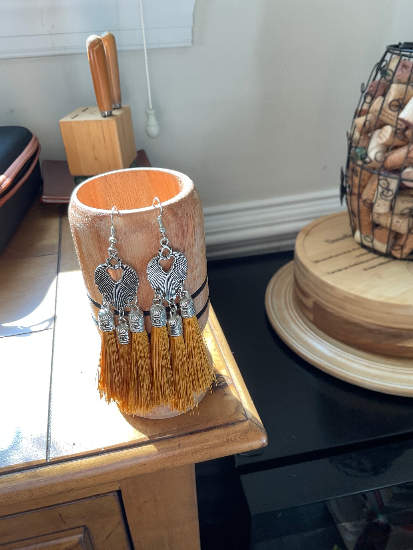 Fringe belief earrings: bronze lion