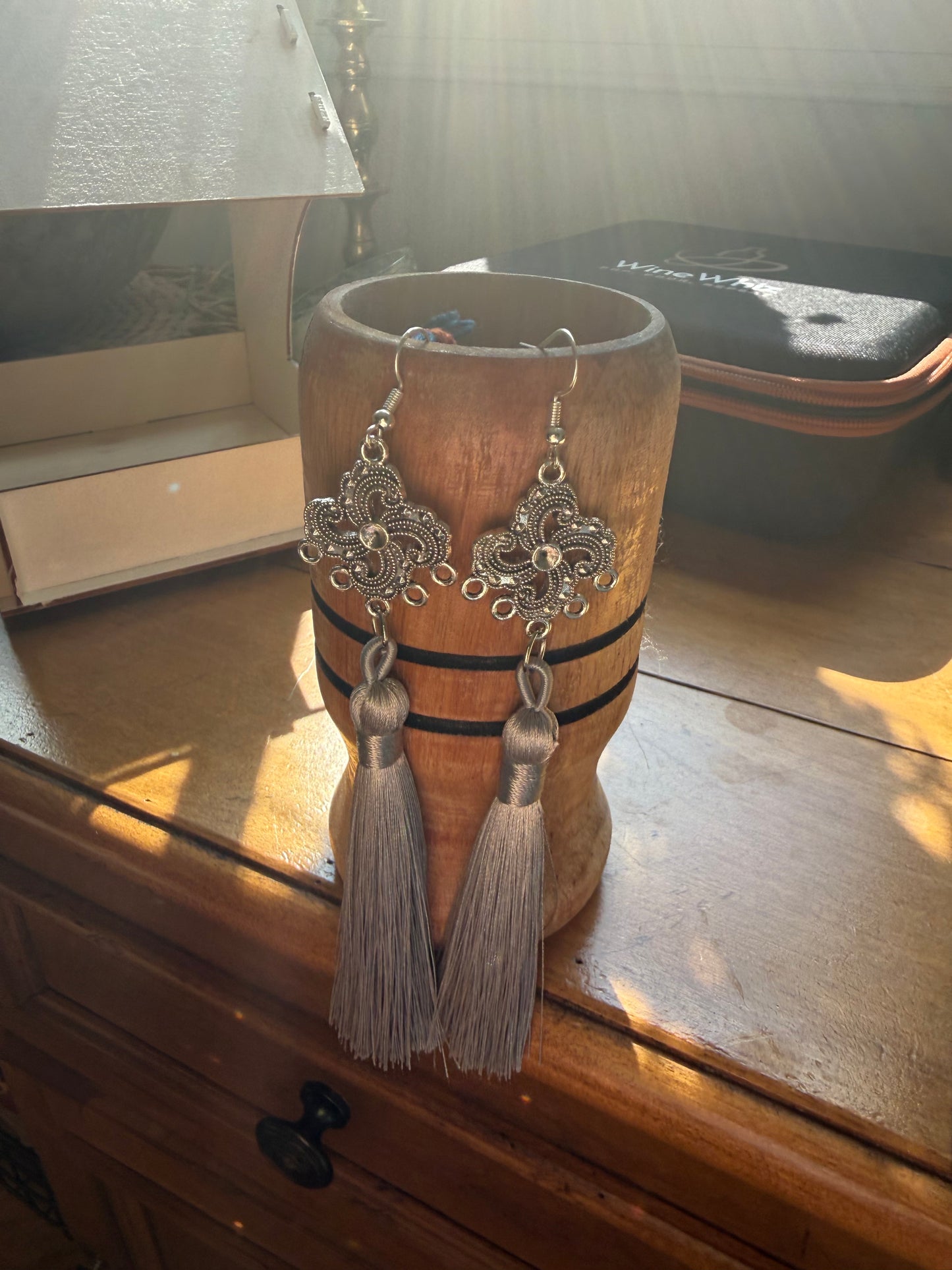 Fringe belief earrings: gray and distinguished