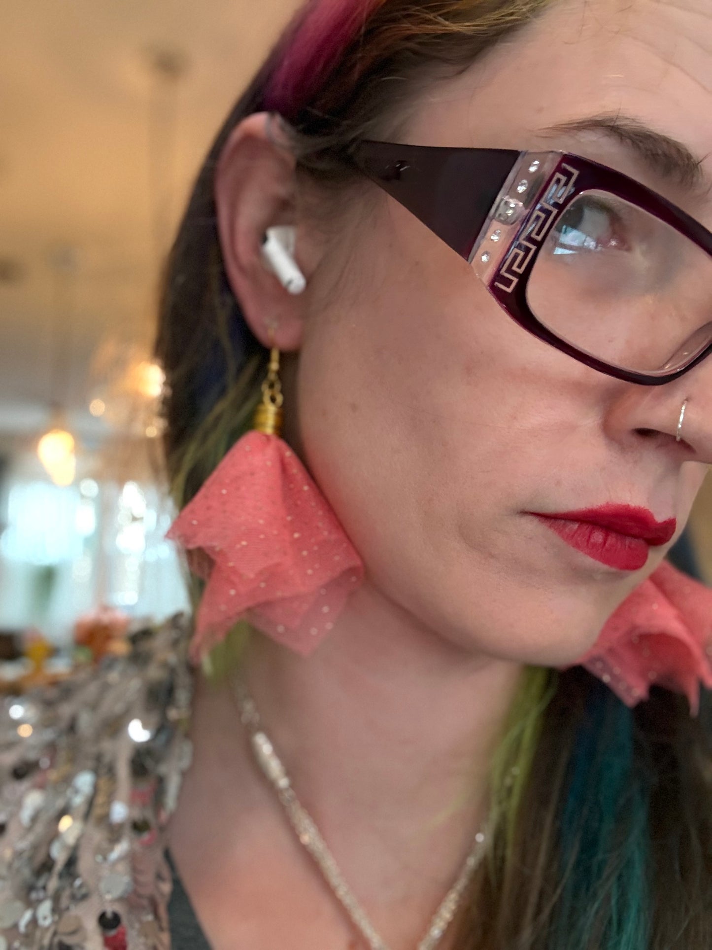 Fringe belief earrings— cults always promise space travel