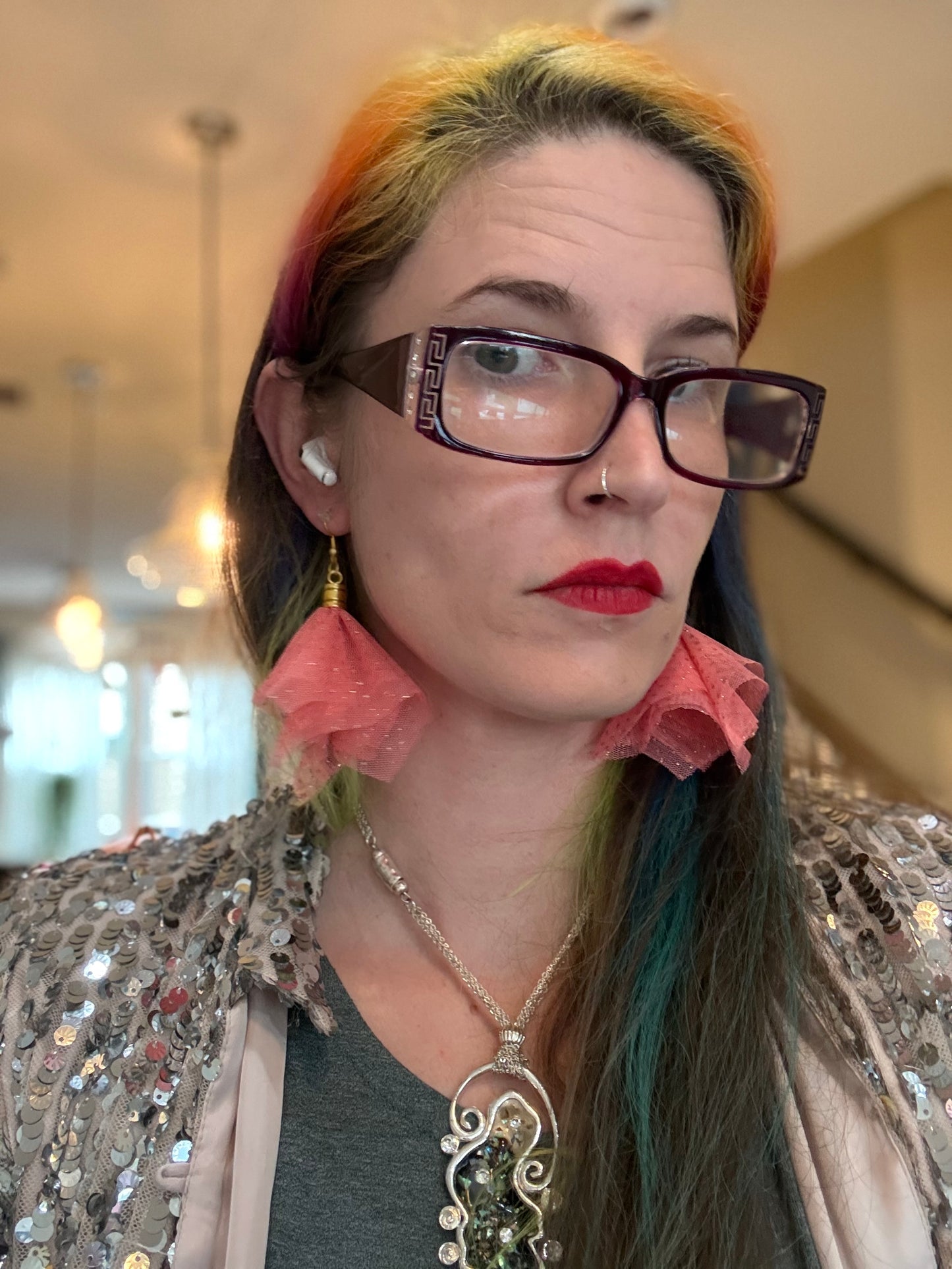 Fringe belief earrings— cults always promise space travel