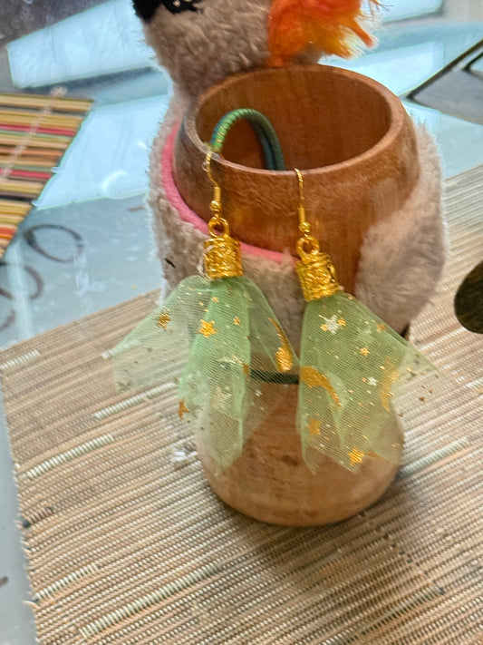 Fringe belief earrings— cults always promise space travel